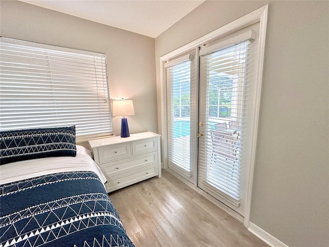 5205 Hammock Cir, Saint Cloud, FL 34771 - bedroom featuring access to outside and light wood-style flooring