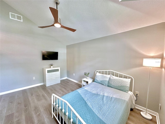 5205 Hammock Cir, Saint Cloud, FL 34771 - bedroom with lofted ceiling, wood finished floors, and ceiling fan