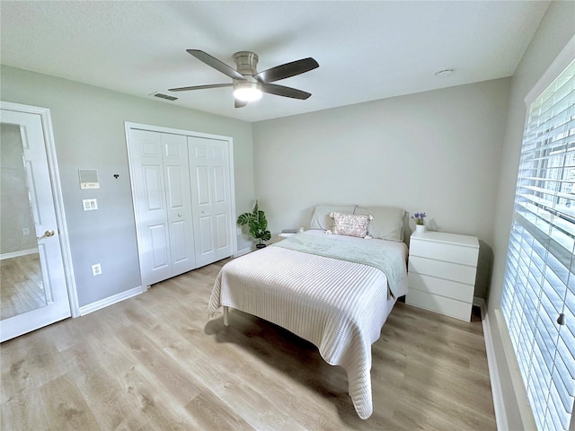 5205 Hammock Cir, Saint Cloud, FL 34771 - bedroom with light wood-type flooring, a closet, and ceiling fan