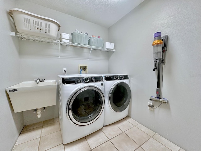 5205 Hammock Cir, Saint Cloud, FL 34771 - laundry area featuring washer and clothes dryer and light tile patterned floors