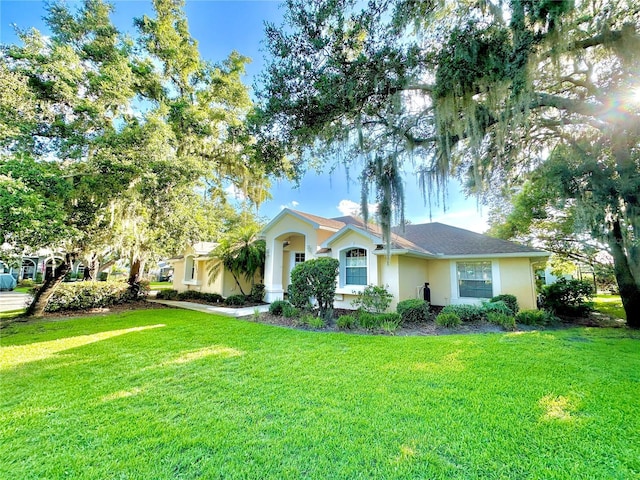 5205 Hammock Cir, Saint Cloud, FL 34771 - view of front of property featuring stucco siding and a front yard