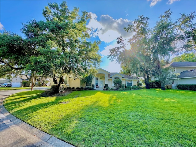 5205 Hammock Cir, Saint Cloud, FL 34771 - view of front of property featuring a front lawn and stucco siding