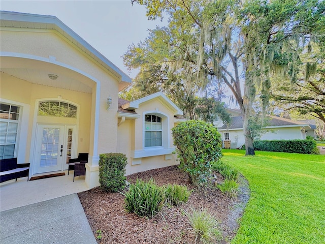 5205 Hammock Cir, Saint Cloud, FL 34771 - property entrance with a lawn and stucco siding