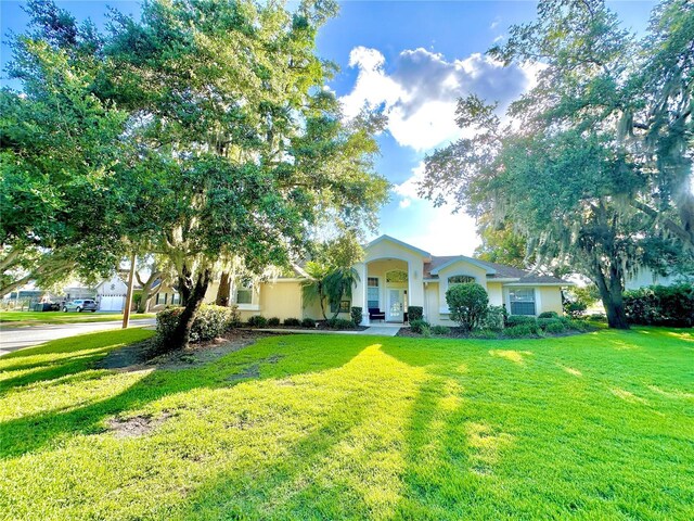 5205 Hammock Cir, Saint Cloud, FL 34771 - view of front of house with a front lawn and stucco siding