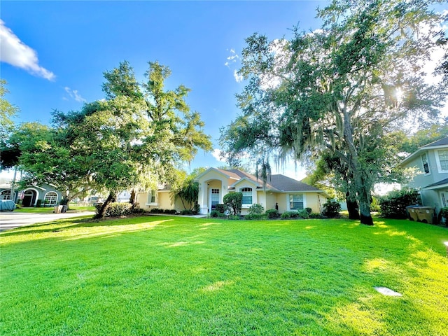 5205 Hammock Cir, Saint Cloud, FL 34771 - view of front facade featuring a front yard and stucco siding