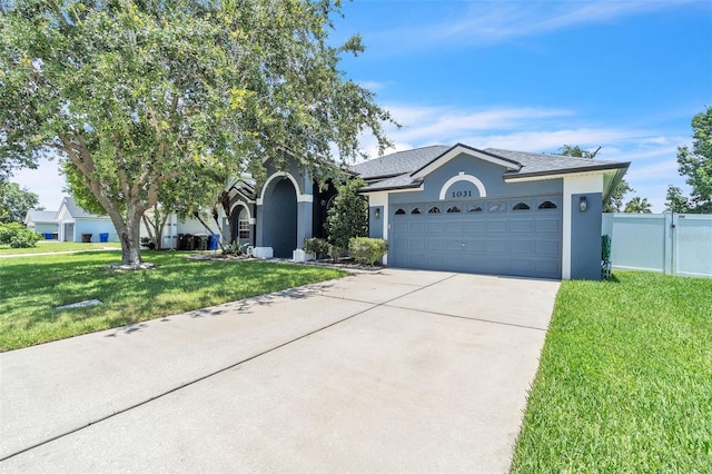 1031 Seneca Trl, Saint Cloud, FL 34772 - single story home featuring stucco siding, driveway, a garage, and roof with shingles