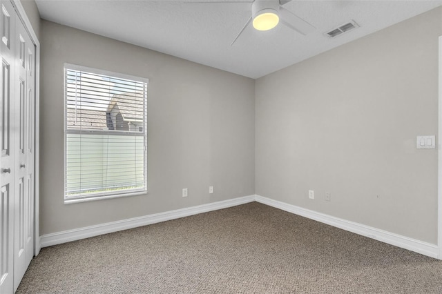 1031 Seneca Trl, Saint Cloud, FL 34772 - spare room featuring carpet floors and a ceiling fan