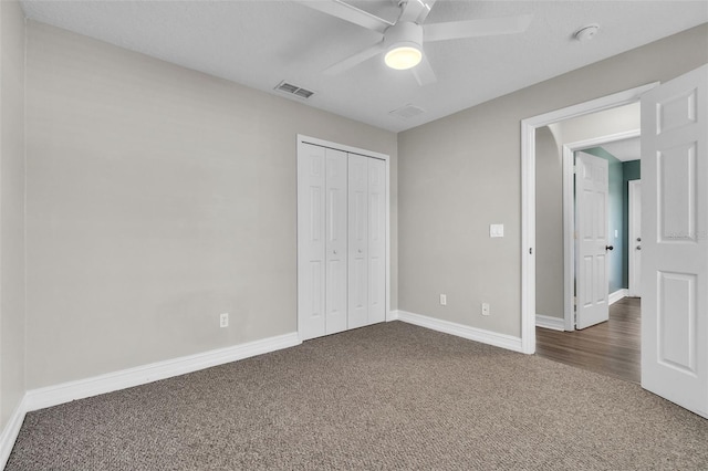 1031 Seneca Trl, Saint Cloud, FL 34772 - unfurnished bedroom with carpet, a closet, and ceiling fan