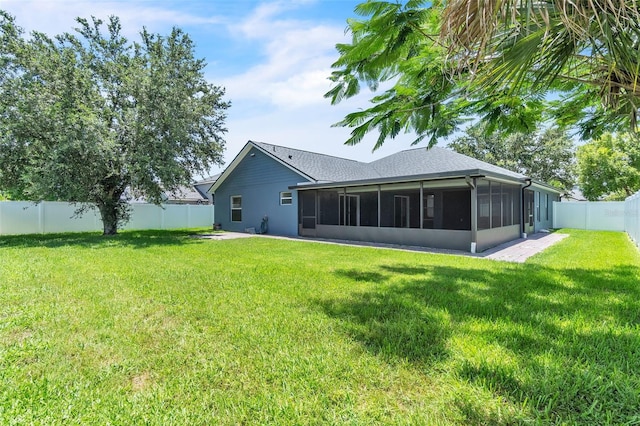 1031 Seneca Trl, Saint Cloud, FL 34772 - rear view of house with a sunroom and a fenced backyard