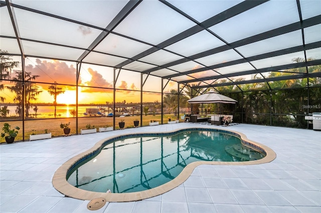 5552 Remsen Cay Ln, Windermere, FL 34786 - pool at dusk featuring an outdoor pool, a patio, a lanai, and a gazebo