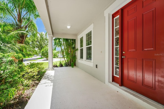 5552 Remsen Cay Ln, Windermere, FL 34786 - view of exterior entry with covered porch and stucco siding