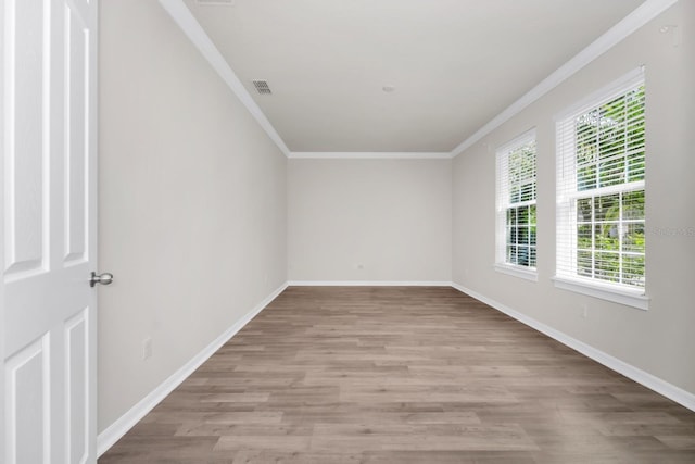 5552 Remsen Cay Ln, Windermere, FL 34786 - spare room featuring plenty of natural light, crown molding, and light wood-type flooring