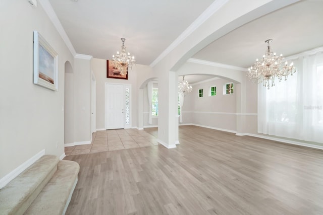 5552 Remsen Cay Ln, Windermere, FL 34786 - foyer entrance featuring a chandelier, arched walkways, light wood-style floors, and crown molding