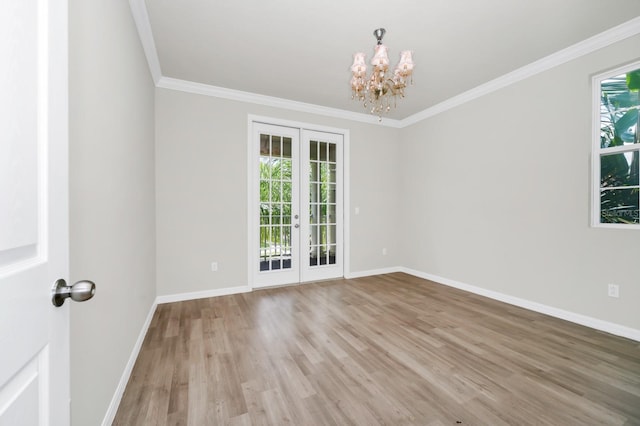 5552 Remsen Cay Ln, Windermere, FL 34786 - unfurnished room with french doors, a chandelier, light wood-style flooring, and crown molding