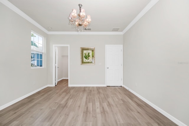 5552 Remsen Cay Ln, Windermere, FL 34786 - spare room with a chandelier, ornamental molding, and light wood-style floors