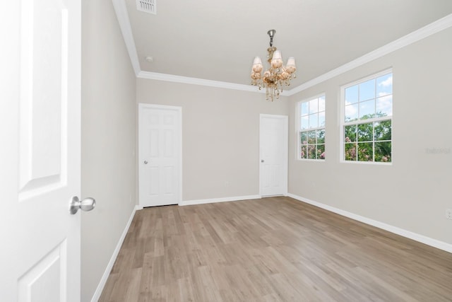 5552 Remsen Cay Ln, Windermere, FL 34786 - unfurnished room with crown molding, a chandelier, and light wood finished floors