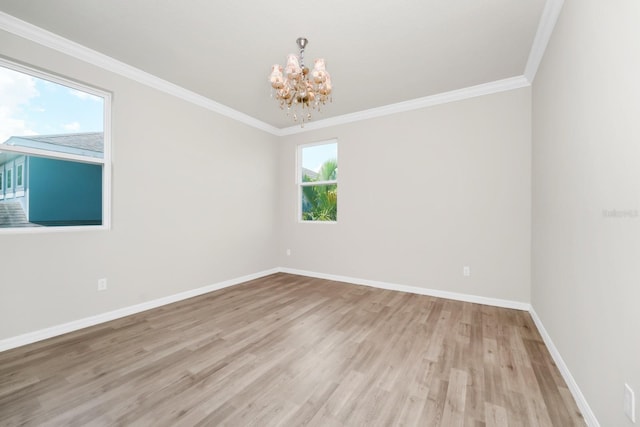 5552 Remsen Cay Ln, Windermere, FL 34786 - unfurnished room with a chandelier, light wood finished floors, and ornamental molding