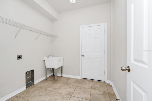 5552 Remsen Cay Ln, Windermere, FL 34786 - washroom with electric dryer hookup and light tile patterned floors