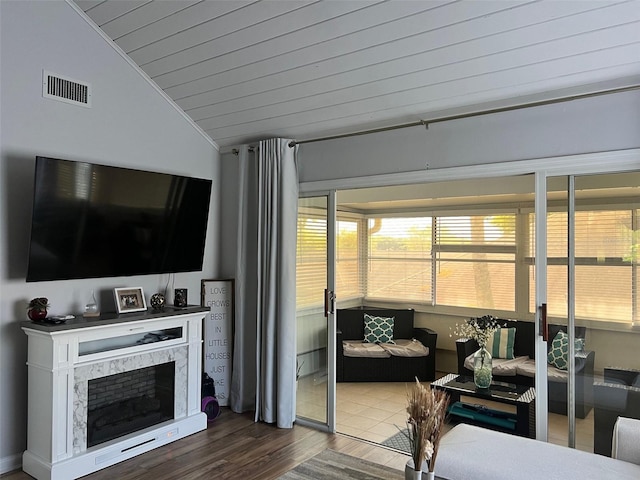 1034 Villa Ln Unit 18, Apopka, FL 32712 - living room featuring lofted ceiling, dark wood-style floors, wood ceiling, and a fireplace