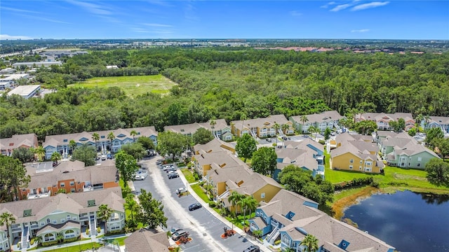 8722 Rockingham Ter Unit B, Kissimmee, FL 34747 - aerial perspective of suburban area featuring a large body of water and a forest