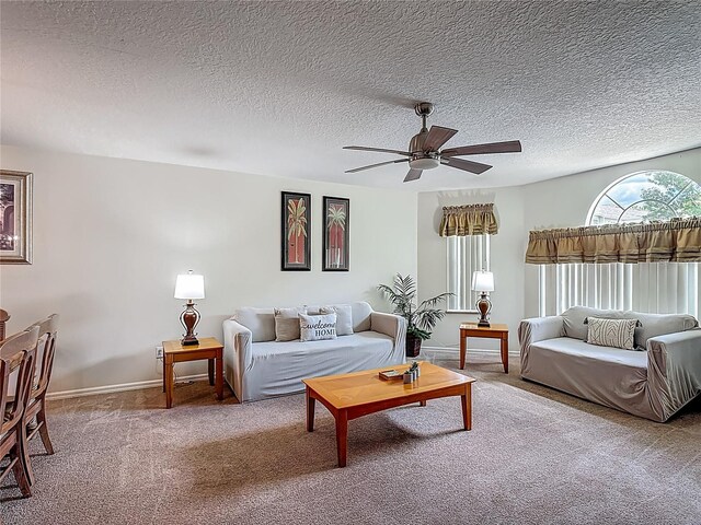 8722 Rockingham Ter Unit B, Kissimmee, FL 34747 - living room featuring a ceiling fan, carpet floors, and a textured ceiling