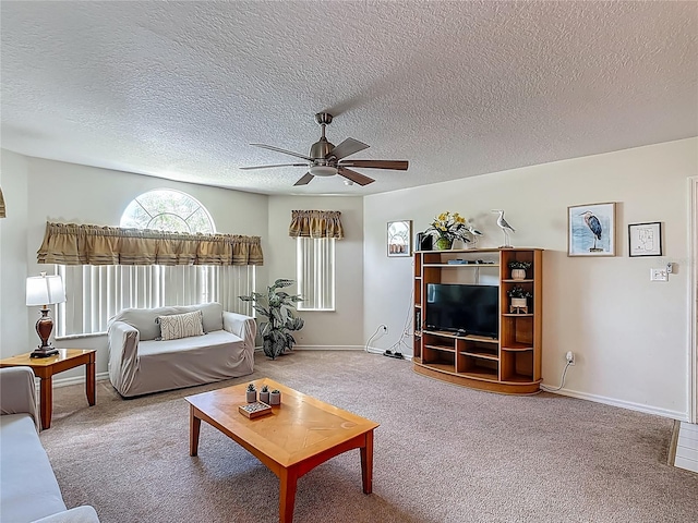 8722 Rockingham Ter Unit B, Kissimmee, FL 34747 - living area with ceiling fan, carpet, and a textured ceiling