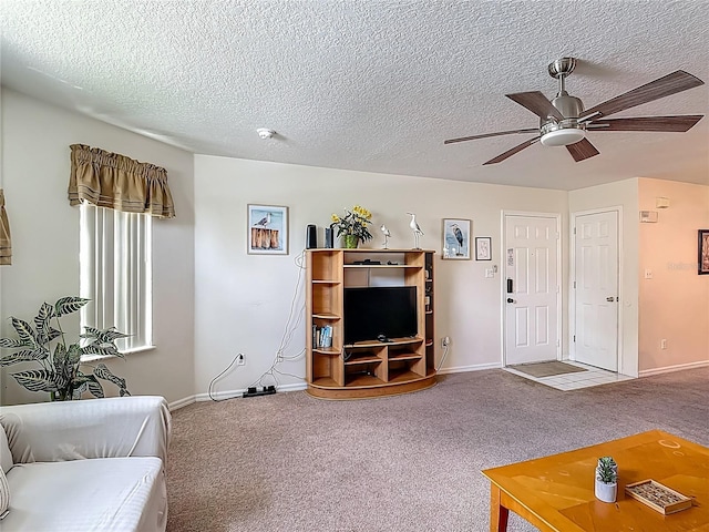 8722 Rockingham Ter Unit B, Kissimmee, FL 34747 - carpeted living area featuring ceiling fan and a textured ceiling