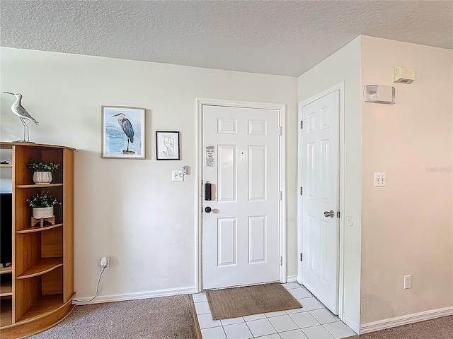 8722 Rockingham Ter Unit B, Kissimmee, FL 34747 - entrance foyer with a textured ceiling and light tile patterned flooring