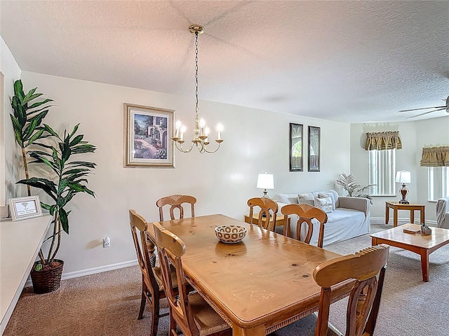 8722 Rockingham Ter Unit B, Kissimmee, FL 34747 - carpeted dining area with a textured ceiling, a chandelier, and a ceiling fan