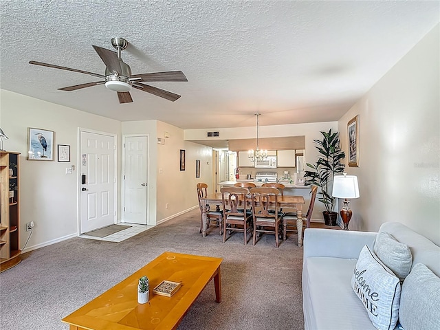 8722 Rockingham Ter Unit B, Kissimmee, FL 34747 - living area with carpet floors, ceiling fan, a chandelier, and a textured ceiling