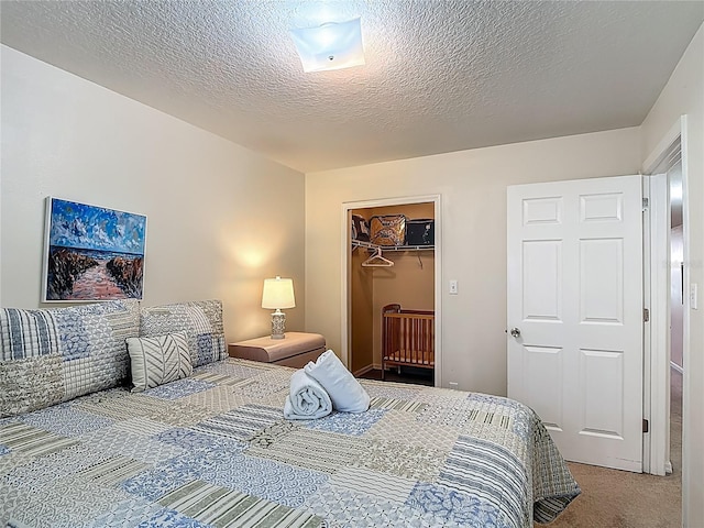 8722 Rockingham Ter Unit B, Kissimmee, FL 34747 - carpeted bedroom with a textured ceiling and a closet