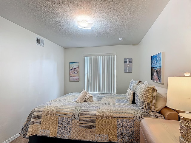 8722 Rockingham Ter Unit B, Kissimmee, FL 34747 - carpeted bedroom with a textured ceiling