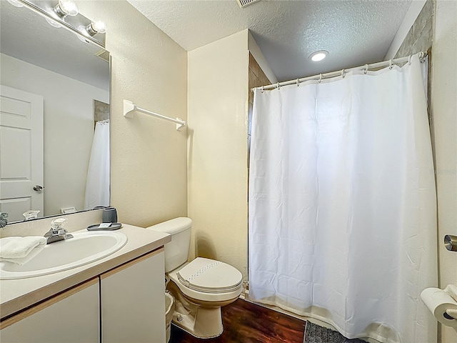 8722 Rockingham Ter Unit B, Kissimmee, FL 34747 - bathroom featuring vanity, wood finished floors, a textured ceiling, and a shower with curtain