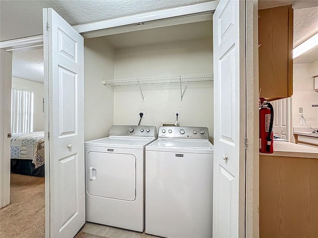 8722 Rockingham Ter Unit B, Kissimmee, FL 34747 - laundry area featuring washer and dryer and light colored carpet