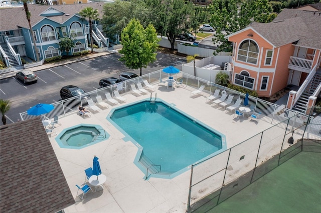 8722 Rockingham Ter Unit B, Kissimmee, FL 34747 - community pool featuring a hot tub, stairs, and a patio