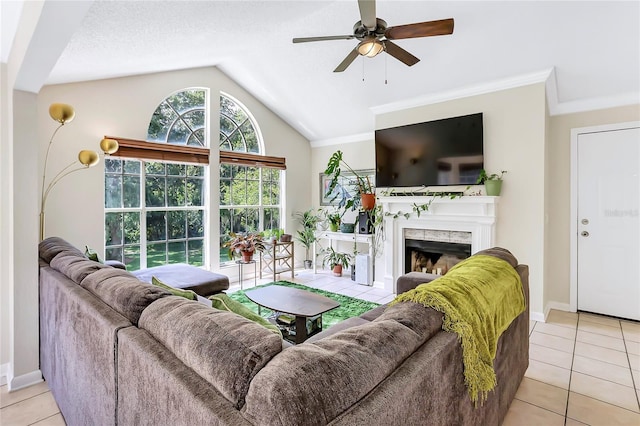 698 Roaring Dr Unit 382, Altamonte Springs, FL 32714 - living room with light tile patterned floors, vaulted ceiling, a high end fireplace, ceiling fan, and ornamental molding