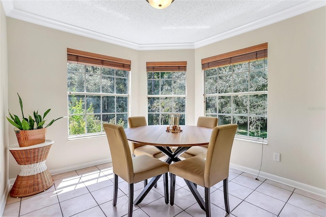 698 Roaring Dr Unit 382, Altamonte Springs, FL 32714 - dining space featuring a textured ceiling, healthy amount of natural light, light tile patterned flooring, and ornamental molding