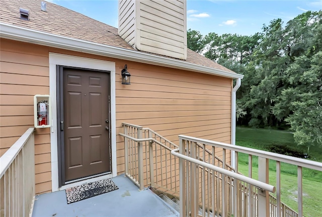 698 Roaring Dr Unit 382, Altamonte Springs, FL 32714 - entrance to property featuring roof with shingles, a chimney, and a yard