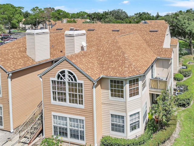 698 Roaring Dr Unit 382, Altamonte Springs, FL 32714 - rear view of property with roof with shingles and a chimney