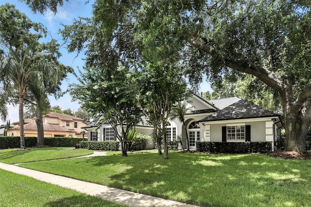 2890 Wild Ginger Ct, Winter Park, FL 32792 - view of front of property with stucco siding and a front lawn