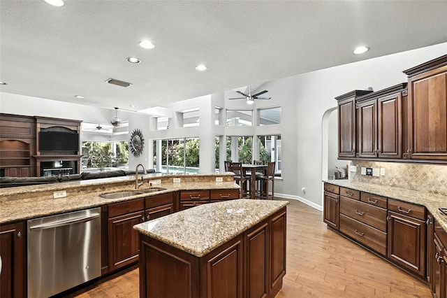 2890 Wild Ginger Ct, Winter Park, FL 32792 - kitchen featuring ceiling fan, dishwasher, open floor plan, backsplash, and plenty of natural light