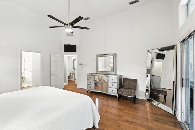 2890 Wild Ginger Ct, Winter Park, FL 32792 - bedroom featuring a towering ceiling, dark wood-type flooring, and a ceiling fan