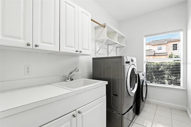 2890 Wild Ginger Ct, Winter Park, FL 32792 - laundry room with washer and dryer, cabinet space, and light tile patterned floors