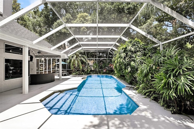 2890 Wild Ginger Ct, Winter Park, FL 32792 - outdoor pool featuring a patio, a ceiling fan, and glass enclosure