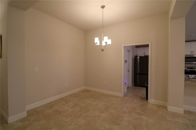1105 Citrus Landings Blvd, Davenport, FL 33837 - empty room with a chandelier and baseboards