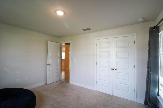 1105 Citrus Landings Blvd, Davenport, FL 33837 - unfurnished bedroom featuring carpet and a closet