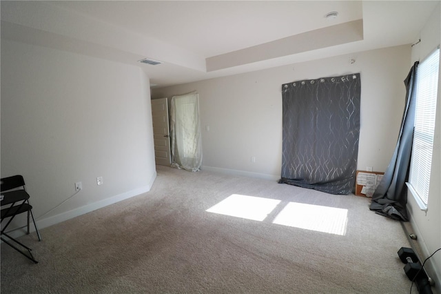 1105 Citrus Landings Blvd, Davenport, FL 33837 - unfurnished room featuring carpet floors, a tray ceiling, and a smoke detector