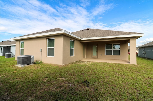 1105 Citrus Landings Blvd, Davenport, FL 33837 - back of house with a patio, stucco siding, roof with shingles, and a yard