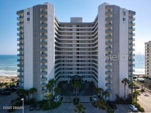 2055 S Atlantic Ave Unit 505, Daytona Beach, FL 32118 - view of apartment building / complex featuring a water view