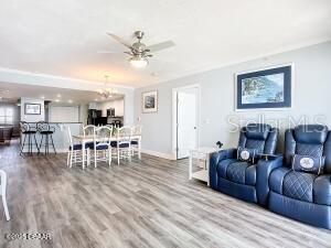 2055 S Atlantic Ave Unit 505, Daytona Beach, FL 32118 - living room featuring a ceiling fan and wood finished floors